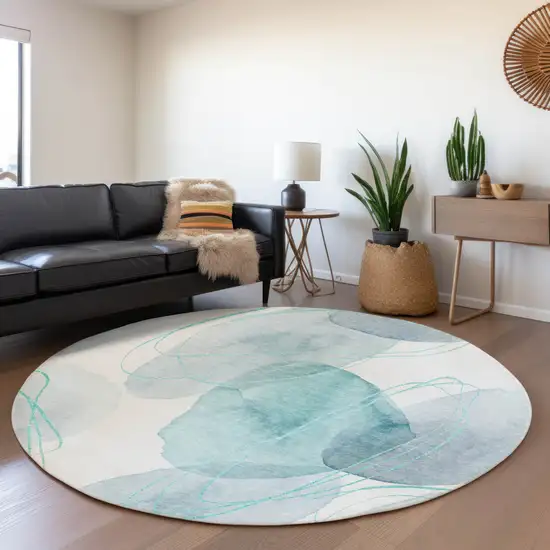 8' Teal And Ivory Abstract Washable Round Rug With UV Protection Photo 5