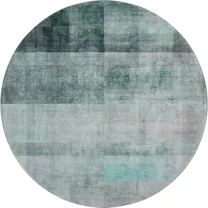 Photo of 8' Teal And Ivory Abstract Washable Round Rug With UV Protection
