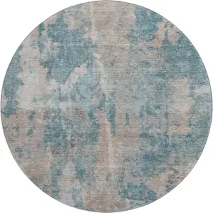 Photo of 8' Teal And Ivory Abstract Washable Round Rug With UV Protection