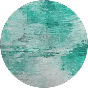 Photo of 8' Teal And Ivory Abstract Washable Round Rug With UV Protection