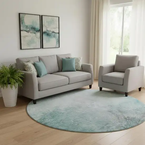 8' Teal And Ivory Abstract Washable Round Rug With UV Protection Photo 1