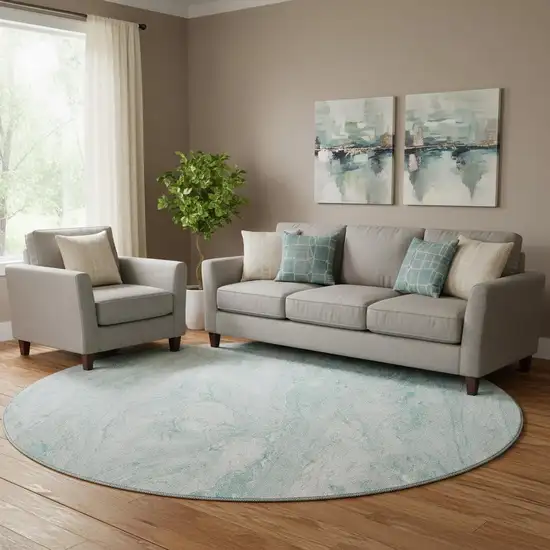 8' Teal And Ivory Abstract Washable Round Rug With UV Protection Photo 1