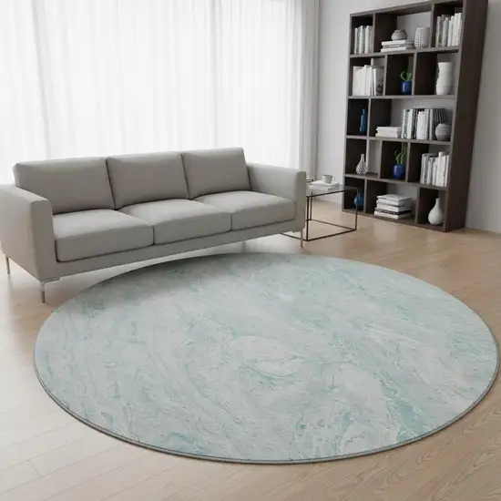 8' Teal And Ivory Abstract Washable Round Rug With UV Protection Photo 2