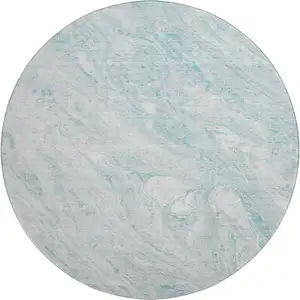 Photo of 8' Teal And Ivory Abstract Washable Round Rug With UV Protection