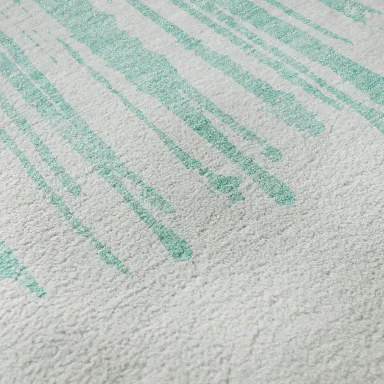 8' Teal And Ivory Abstract Washable Round Rug With UV Protection Photo 8