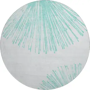 Photo of 8' Teal And Ivory Abstract Washable Round Rug With UV Protection