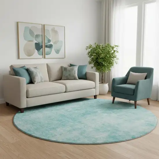 8' Teal And Ivory Abstract Washable Round Rug With UV Protection Photo 1