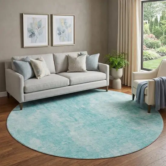 8' Teal And Ivory Abstract Washable Round Rug With UV Protection Photo 1