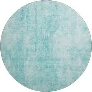 Photo of 8' Teal And Ivory Abstract Washable Round Rug With UV Protection