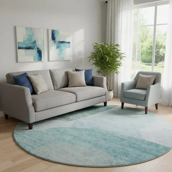 8' Teal And Ivory Abstract Washable Round Rug With UV Protection Photo 1