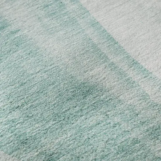 8' Teal And Ivory Abstract Washable Round Rug With UV Protection Photo 8