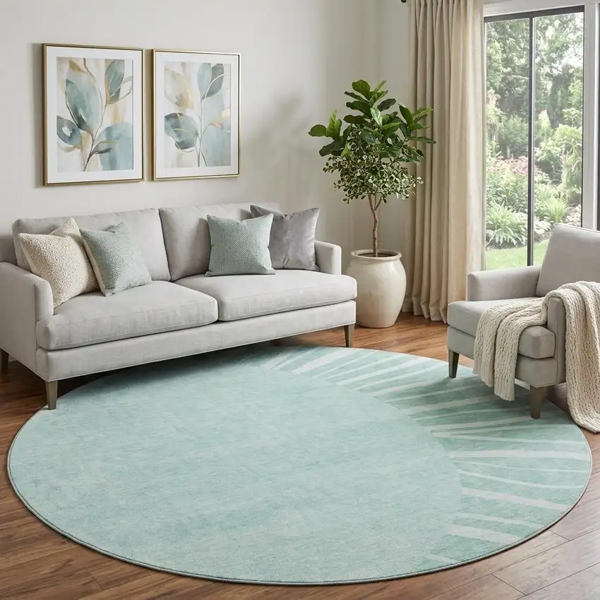 8' Teal And Ivory Abstract Washable Round Rug With UV Protection Photo 1