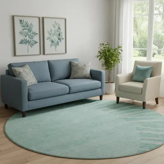 8' Teal And Ivory Abstract Washable Round Rug With UV Protection Photo 1
