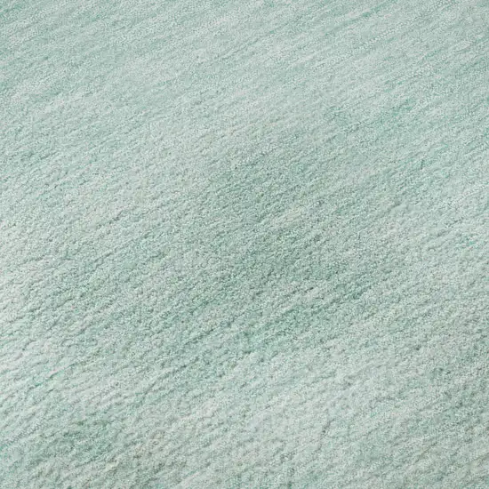 8' Teal And Ivory Abstract Washable Round Rug With UV Protection Photo 8