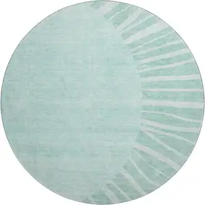 Photo of 8' Teal And Ivory Abstract Washable Round Rug With UV Protection