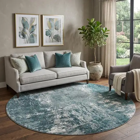 8' Teal And Ivory Abstract Washable Round Rug With UV Protection Photo 1