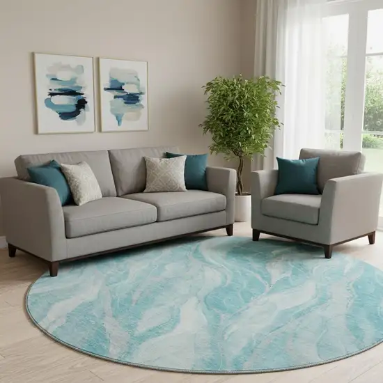 8' Teal And Ivory Abstract Washable Round Rug With UV Protection Photo 1