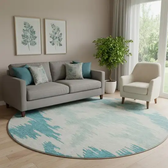 8' Teal And Ivory Abstract Washable Round Rug With UV Protection Photo 1
