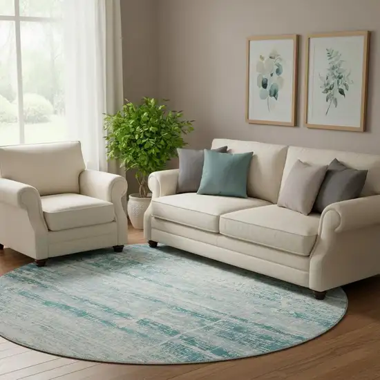 8' Teal And Ivory Abstract Washable Round Rug With UV Protection Photo 1