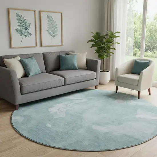 8' Teal And Ivory Abstract Washable Round Rug With UV Protection Photo 1