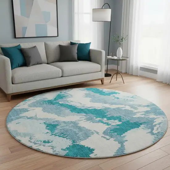 8' Teal And Ivory Abstract Washable Round Rug With UV Protection Photo 1