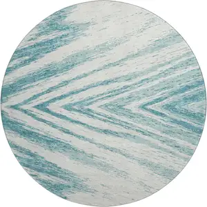 Photo of 8' Teal And Ivory Abstract Washable Round Rug With UV Protection