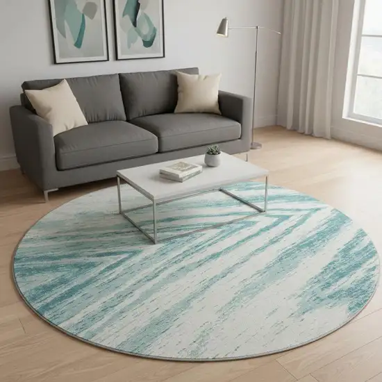 8' Teal And Ivory Abstract Washable Round Rug With UV Protection Photo 2