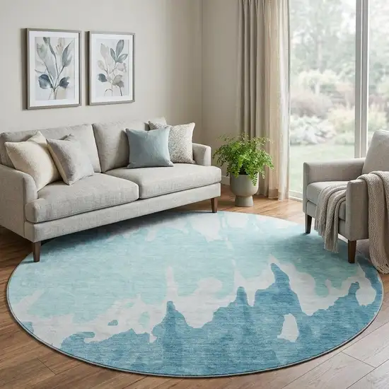 8' Teal And Ivory Abstract Washable Round Rug With UV Protection Photo 1