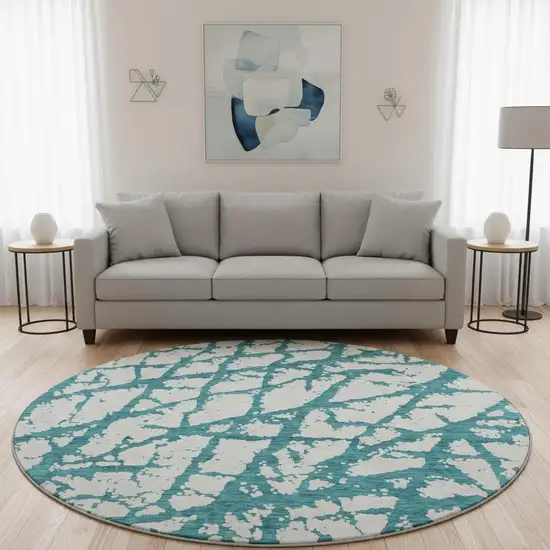 8' Teal And Ivory Abstract Washable Round Rug With UV Protection Photo 2