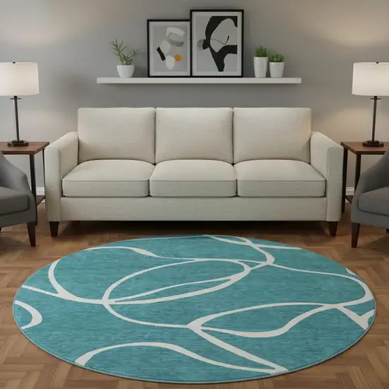 8' Teal And Ivory Abstract Washable Round Rug With UV Protection Photo 2