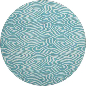 Photo of 8' Teal And Ivory Abstract Washable Round Rug With UV Protection