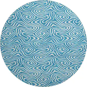 Photo of 8' Teal And Ivory Abstract Washable Round Rug With UV Protection