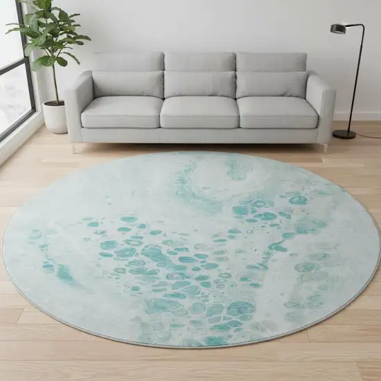 8' Teal And Ivory Abstract Washable Round Rug With UV Protection Photo 2