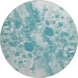 Photo of 8' Teal And Ivory Abstract Washable Round Rug With UV Protection