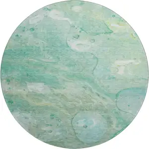 Photo of 8' Teal And Ivory Abstract Washable Round Rug With UV Protection