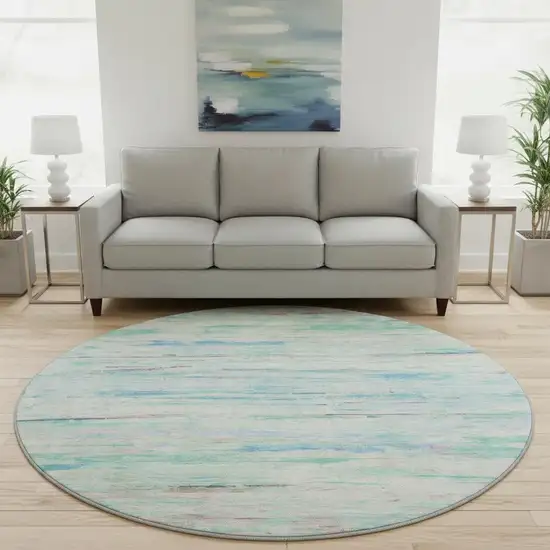8' Teal And Ivory Abstract Washable Round Rug With UV Protection Photo 2