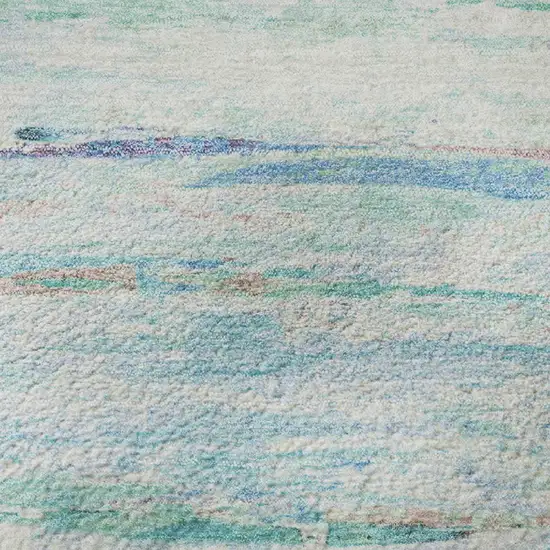 8' Teal And Ivory Abstract Washable Round Rug With UV Protection Photo 9