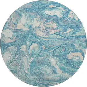 Photo of 8' Teal And Ivory Abstract Washable Round Rug With UV Protection