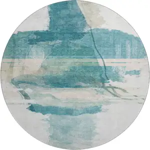 Photo of 8' Teal And Ivory Abstract Washable Round Rug With UV Protection