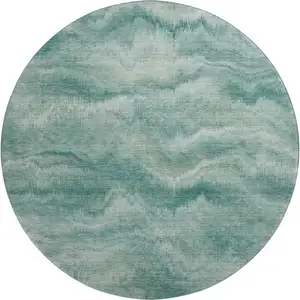 Photo of 8' Teal And Ivory Abstract Washable Round Rug With UV Protection