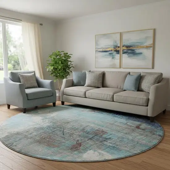 8' Teal And Ivory Abstract Washable Round Rug With UV Protection Photo 1