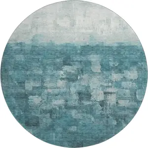 Photo of 8' Teal And Ivory Abstract Washable Round Rug With UV Protection