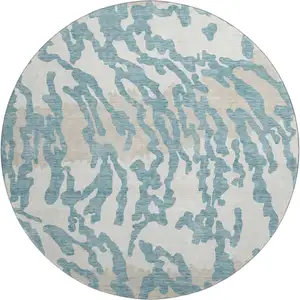 Photo of 8' Teal And Ivory Animal Print Washable Round Rug With UV Protection
