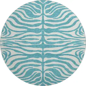 Photo of 8' Teal And Ivory Animal Print Washable Round Rug With UV Protection