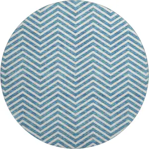 Photo of 8' Teal And Ivory Chevron Washable Round Rug With UV Protection