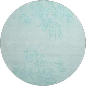 Photo of 8' Teal And Ivory Floral Washable Round Rug With UV Protection