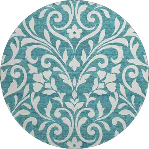 Photo of 8' Teal And Ivory Floral Washable Round Rug With UV Protection