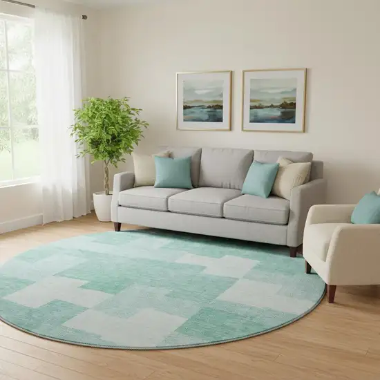 8' Teal And Ivory Geometric Washable Round Rug With UV Protection Photo 1