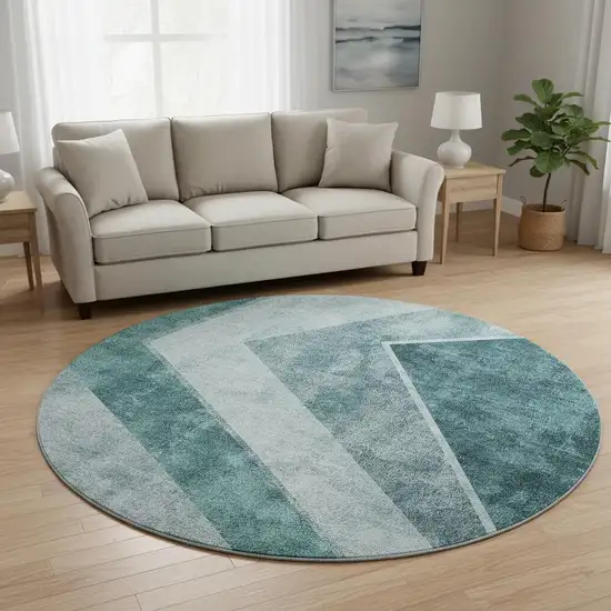 8' Teal And Ivory Geometric Washable Round Rug With UV Protection Photo 2