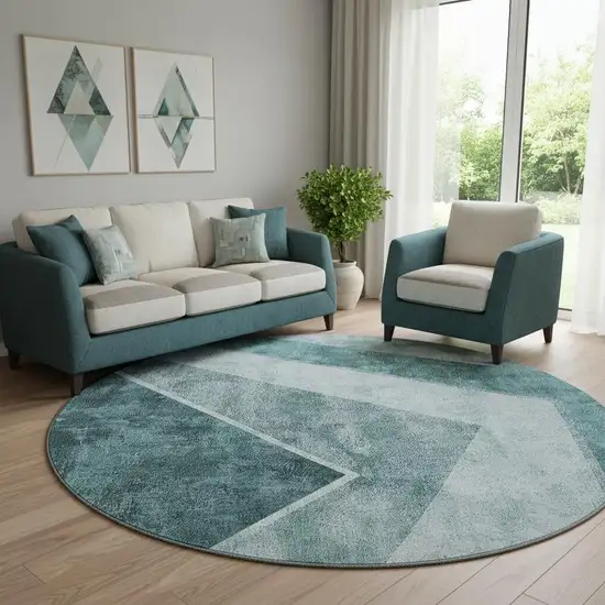 8' Teal And Ivory Geometric Washable Round Rug With UV Protection Photo 1
